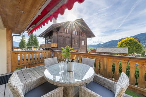 Balcony with table and chairs for outside dining