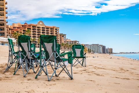 On the beach, sun loungers, beach towels