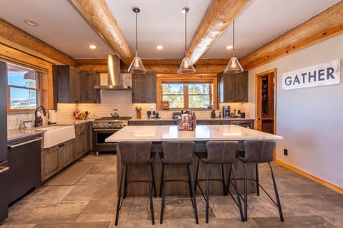 Gourmet kitchen with large pantry and many small appliances to cook a gourmet meal at home. 