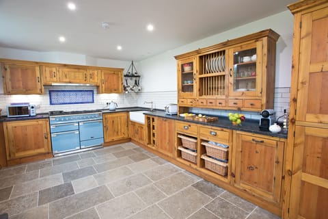 Kitchen with range cooker, double sink, dishwasher & dresser