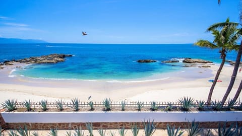 On the beach, sun loungers, beach towels