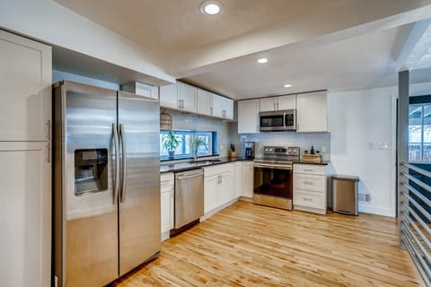 Spacious kitchen with large fridge, oven, dishwasher, coffee maker and more!