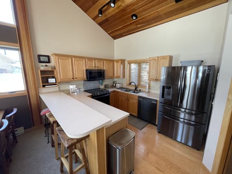 Kitchen - brand new black stainless steel appliances. Extra large fridge