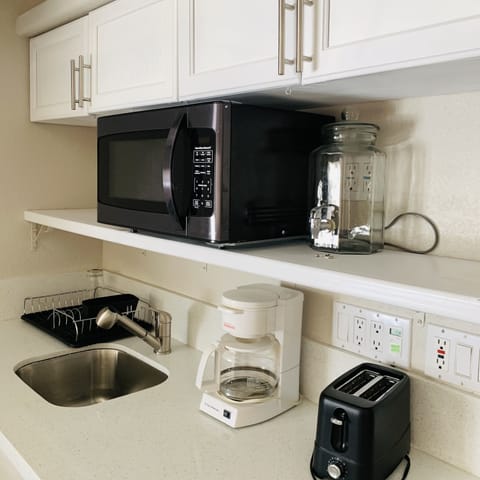 Fridge, microwave, coffee/tea maker, toaster