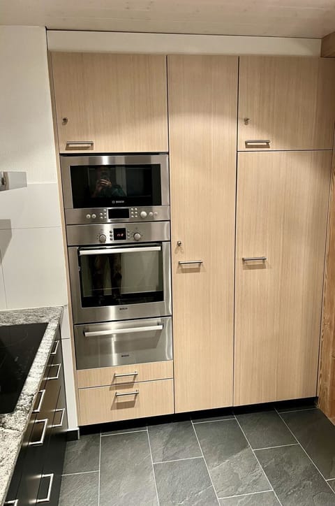 Flooring, Wood, Kitchen Appliance, Floor, Kitchen, Interior Design, Cabinetry, Major Appliance, Home Appliance, Cupboard