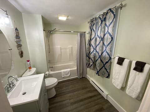 Combined shower/tub, hair dryer, towels, soap