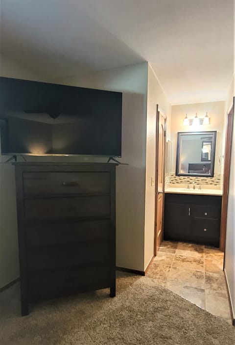 Separate sink in the primary bedroom. Walkin closet with robes!!