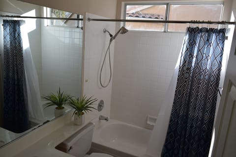 Combined shower/tub, hair dryer, towels, soap