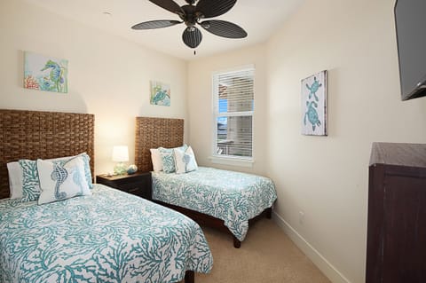 Third bedroom with twin beds and AC is perfect for kids or additional guests.