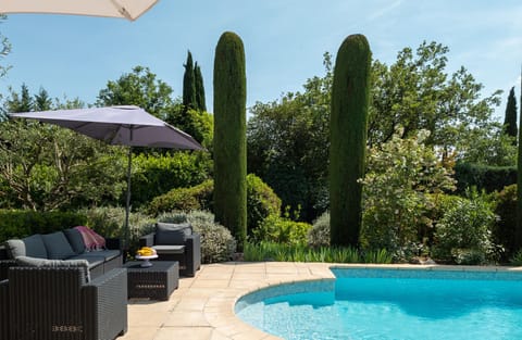 A heated pool, sun loungers