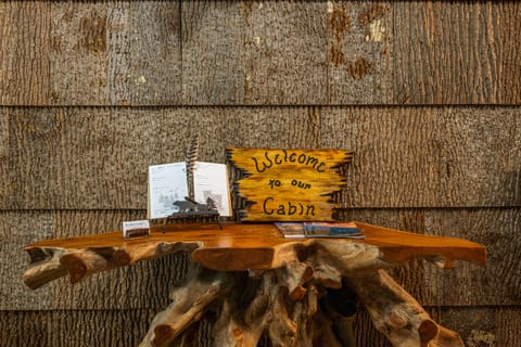 "Step into serenity! Our bark entryway welcomes you to a cozy retreat amidst nature's embrace.