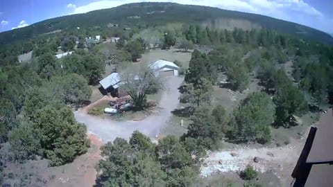 An aerial view of the cabin. The roof of owners' house is bottom right.