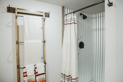 Combined shower/tub, hair dryer, towels, soap