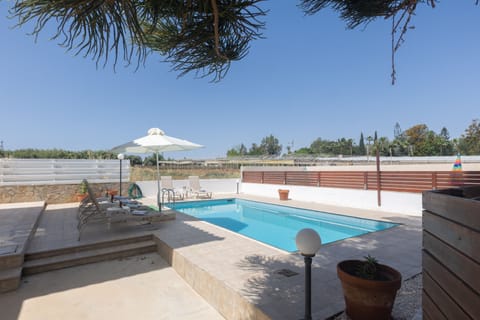 Outdoor pool, a heated pool, sun loungers