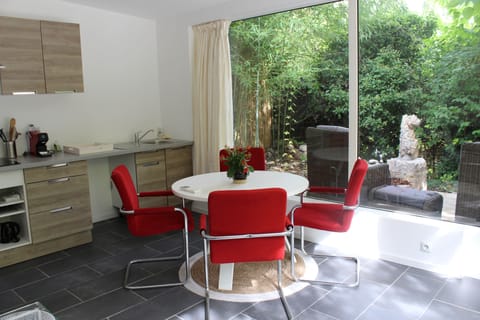  Dining and kitchen area with garden view