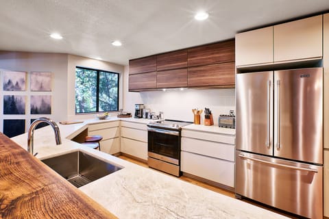 A spacious chef's kitchen is equipped with everything  your inner-foodie needs.