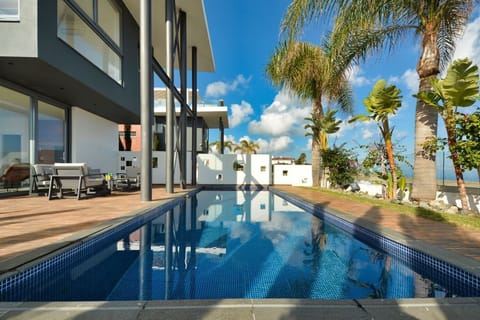 Outdoor pool, a heated pool, sun loungers