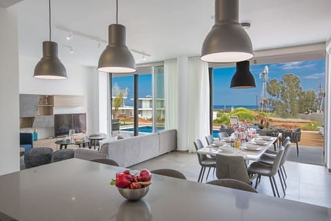 Living room and dining area with seaviews