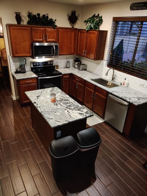 Kitchen with pantry,utensils,pans,dishes & appliances available for you.