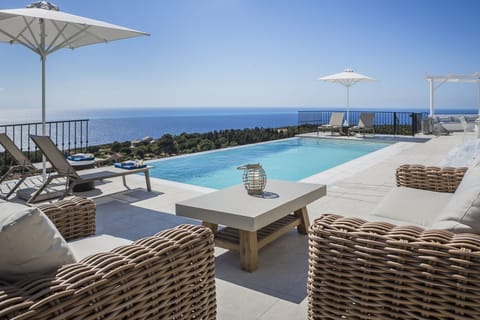 An infinity pool, sun loungers