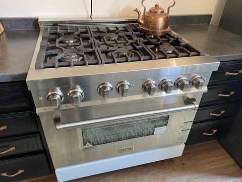 Six burner gas range in tea room kitchen, two ovens, wine and beverage center