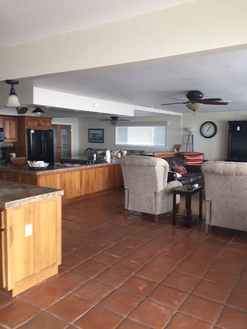Open floor plan showing living room, dining area, kitchen and bar area