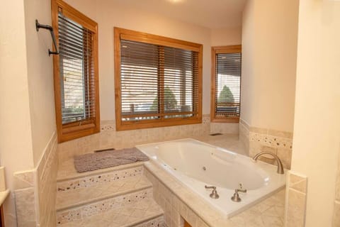 Master Bathroom with Jetted Jacuzzi-Style Soaking Tub with Tile Surround