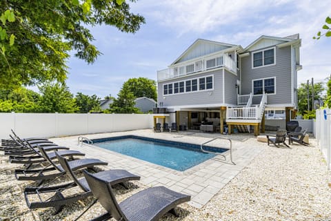 A heated pool, sun loungers