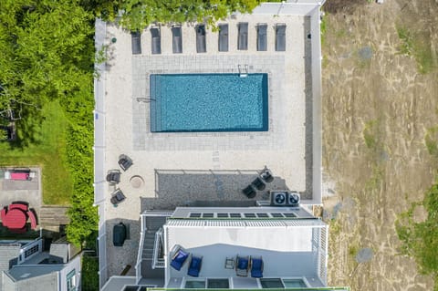 A heated pool, sun loungers