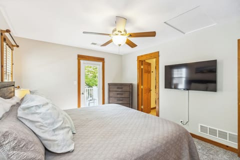 Primary bedroom with king bed, en suite bath and access to second floor deck