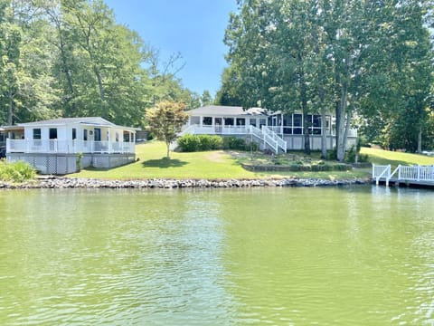 The Lakehouse sits on 330 ft of water frontage w/ a flat lot & large dock. 
