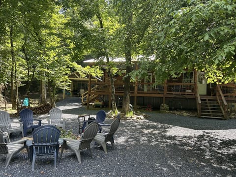 OUTSIDE OF CABIN WITH FIREPIT 