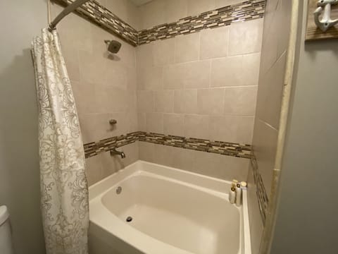 Combined shower/tub, hair dryer, towels, soap