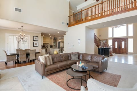 Main living room features leather couches.