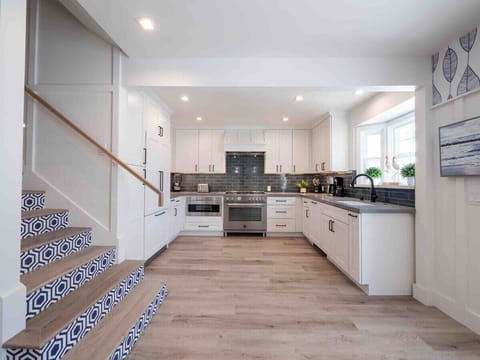 Modern kitchen with Bertazzoni oven and Fisher Paykel refrigerator and dishwasher. Coffee Maker. Blender, Toaster provided.