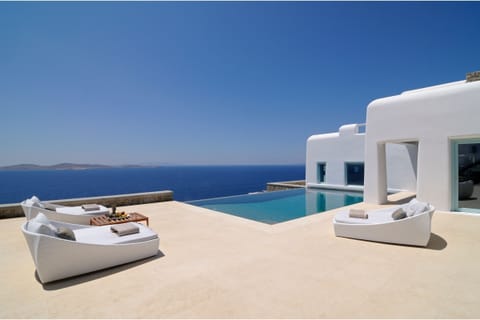 An infinity pool, sun loungers