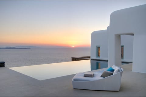 An infinity pool, sun loungers