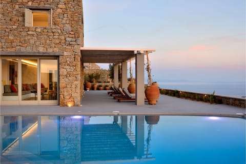 An infinity pool, sun loungers