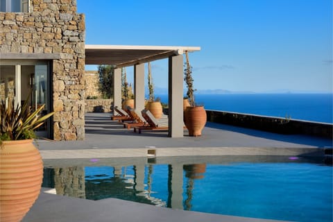 An infinity pool, sun loungers