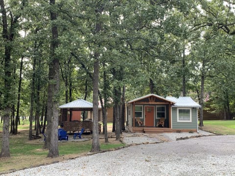 Nestled in the trees on 3 lots. Sit on the porch, gazebo or firepit area.