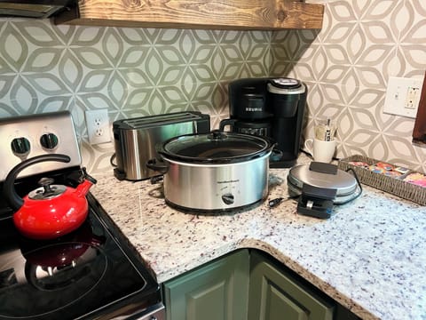 Toaster, slow cooker, waffle maker, blender, tea kettle and dual coffee maker.