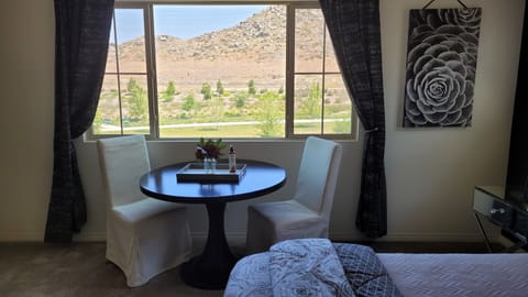 Master bedroom w/Nook table and serene mountain views.