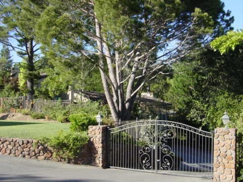 Gated acre with a private drive shared by only 2 other homes. Total privacy