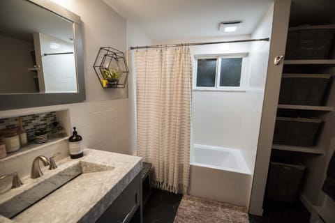 Combined shower/tub, hair dryer, towels, soap