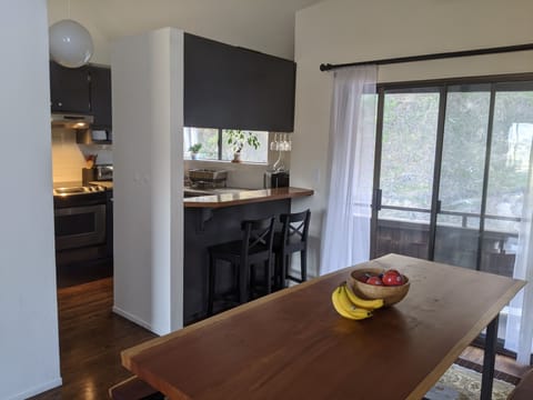 The dining table and kitchen area