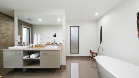 Bathtub, eco-friendly toiletries, hair dryer, slippers