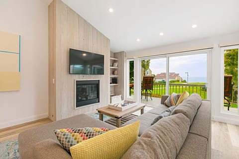 Welcome to the light, bright, living space with soaring ceilings. And that view!