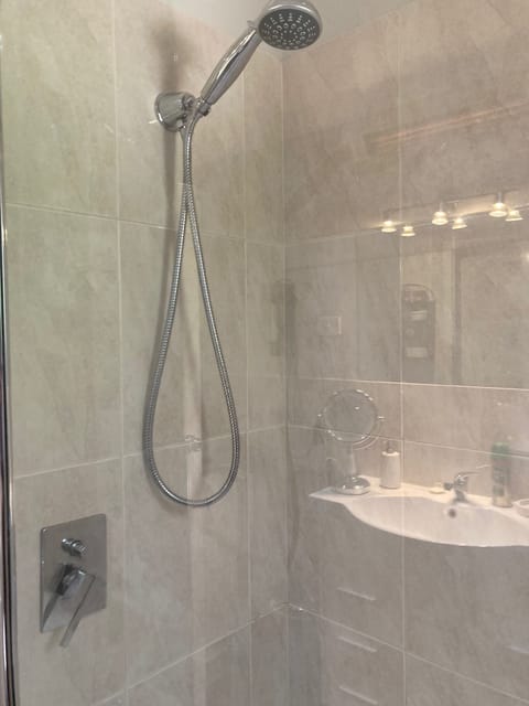 Combined shower/tub, hair dryer, towels, soap