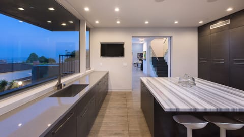 Kitchen area with gorgeous marble island and views of the city