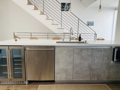 2nd Floor Kitchen Island with wine cooler, dishwasher and microwave.